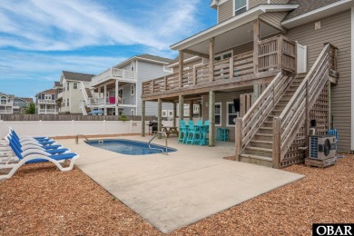 This turnkey 5-bedroom, 3.5-bath home is in the community of on The Currituck Golf Club in North Carolina - for sale on GolfHomes.com, golf home, golf lot