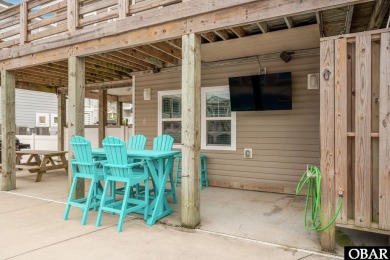 This turnkey 5-bedroom, 3.5-bath home is in the community of on The Currituck Golf Club in North Carolina - for sale on GolfHomes.com, golf home, golf lot