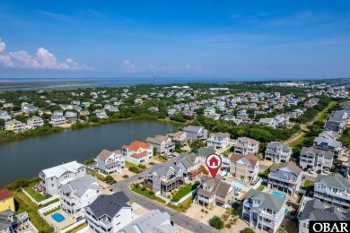 This turnkey 5-bedroom, 3.5-bath home is in the community of on The Currituck Golf Club in North Carolina - for sale on GolfHomes.com, golf home, golf lot