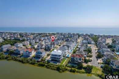 This turnkey 5-bedroom, 3.5-bath home is in the community of on The Currituck Golf Club in North Carolina - for sale on GolfHomes.com, golf home, golf lot