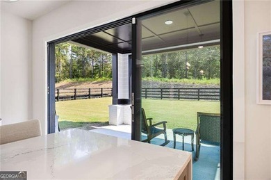 Welcome home to this executive home built by the Toll Brothers on Capital City Club Crabapple in Georgia - for sale on GolfHomes.com, golf home, golf lot