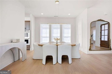 Welcome home to this executive home built by the Toll Brothers on Capital City Club Crabapple in Georgia - for sale on GolfHomes.com, golf home, golf lot