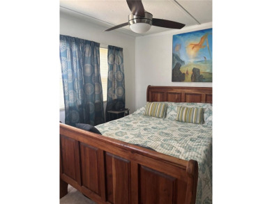 Nestled in the highly sought-after 55+ community of IMPERIAL on Bay Tree Golf Course in Florida - for sale on GolfHomes.com, golf home, golf lot
