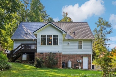 Nestled in the sought-after gated community of Carolina Trace on Carolina Trace Country Club in North Carolina - for sale on GolfHomes.com, golf home, golf lot