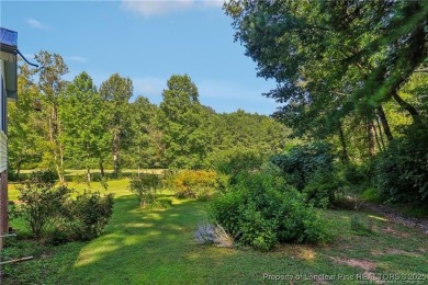 Nestled in the sought-after gated community of Carolina Trace on Carolina Trace Country Club in North Carolina - for sale on GolfHomes.com, golf home, golf lot