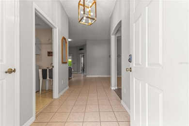 BOND PAID!! NO CARPET!! ROOF 2017!!! Welcome to this charming on El Santiago Executive Golf Course in Florida - for sale on GolfHomes.com, golf home, golf lot