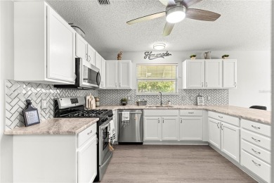 BOND PAID!! NO CARPET!! ROOF 2017!!! Welcome to this charming on El Santiago Executive Golf Course in Florida - for sale on GolfHomes.com, golf home, golf lot
