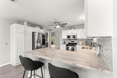BOND PAID!! NO CARPET!! ROOF 2017!!! Welcome to this charming on El Santiago Executive Golf Course in Florida - for sale on GolfHomes.com, golf home, golf lot