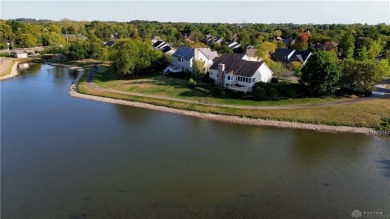 Enjoy a beautiful view of the lake from your large covered front on The Golf Club At Yankee Trace in Ohio - for sale on GolfHomes.com, golf home, golf lot