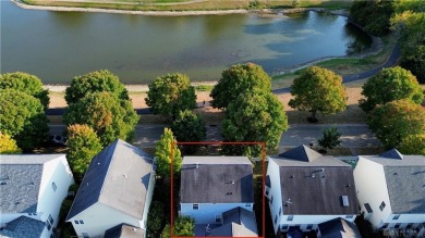 Enjoy a beautiful view of the lake from your large covered front on The Golf Club At Yankee Trace in Ohio - for sale on GolfHomes.com, golf home, golf lot