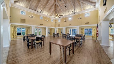 Enjoy sunny, panoramic views across the pool, lakes, and golf on Pinebrook/Ironwood Golf Course in Florida - for sale on GolfHomes.com, golf home, golf lot