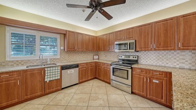 Enjoy sunny, panoramic views across the pool, lakes, and golf on Pinebrook/Ironwood Golf Course in Florida - for sale on GolfHomes.com, golf home, golf lot