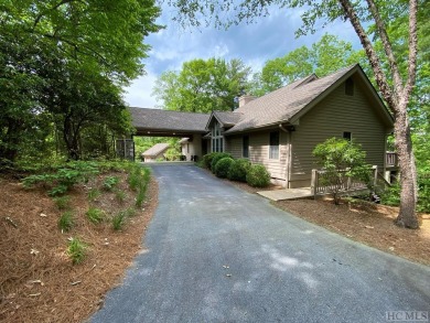 This 3 bedroom 4 and a half bath home sits on a double lot with on Lake Toxaway Country Club in North Carolina - for sale on GolfHomes.com, golf home, golf lot
