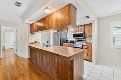 This beautifully maintained home has had all the big-ticket on Meadow Oaks Golf and Country Club in Florida - for sale on GolfHomes.com, golf home, golf lot