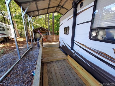 Begin your journey to relaxation at River Ridge Golf & Camping on River Ridge Golf Club in Virginia - for sale on GolfHomes.com, golf home, golf lot