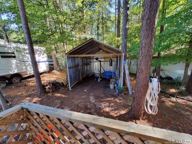 Begin your journey to relaxation at River Ridge Golf & Camping on River Ridge Golf Club in Virginia - for sale on GolfHomes.com, golf home, golf lot