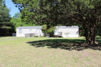 Affordable 3BDR/2BA single-wide manufactured home on one acre on Rivers Edge Golf Club in North Carolina - for sale on GolfHomes.com, golf home, golf lot