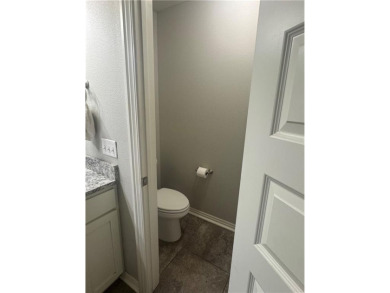 Located in a quiet, family-friendly neighborhood, this home is on Stonebridge Meadows Golf Club in Arkansas - for sale on GolfHomes.com, golf home, golf lot