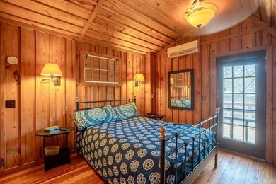 This comfortable cabin is located in a prime trout fishing area on  in Arkansas - for sale on GolfHomes.com, golf home, golf lot