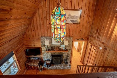 This comfortable cabin is located in a prime trout fishing area on  in Arkansas - for sale on GolfHomes.com, golf home, golf lot