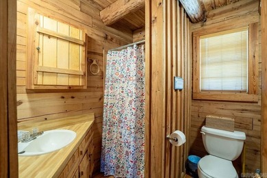 This comfortable cabin is located in a prime trout fishing area on  in Arkansas - for sale on GolfHomes.com, golf home, golf lot