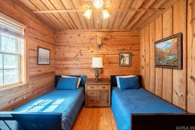 This comfortable cabin is located in a prime trout fishing area on  in Arkansas - for sale on GolfHomes.com, golf home, golf lot