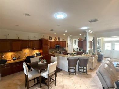 This stunning water-front single-family home at 13111 SE 86th on Eagle Ridge At Spruce Creek Country Club in Florida - for sale on GolfHomes.com, golf home, golf lot