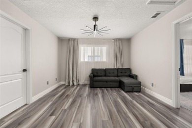 Welcome to this stunning, fully updated 5-bedroom, 3.5-bathroom on Eagle Creek Golf Club in Florida - for sale on GolfHomes.com, golf home, golf lot
