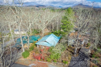 Nestled in the serene beauty of the North Carolina mountains on Land Harbor Golf Course in North Carolina - for sale on GolfHomes.com, golf home, golf lot