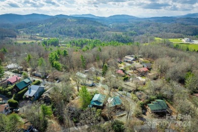 Nestled in the serene beauty of the North Carolina mountains on Land Harbor Golf Course in North Carolina - for sale on GolfHomes.com, golf home, golf lot