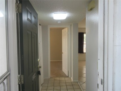 AFFORDBLE GROUND FLOOR 2/2 CONDOMINIUM JUST 500 FEET AWAY FROM on Country Club At Silver Springs Shores in Florida - for sale on GolfHomes.com, golf home, golf lot