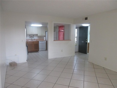 AFFORDBLE GROUND FLOOR 2/2 CONDOMINIUM JUST 500 FEET AWAY FROM on Country Club At Silver Springs Shores in Florida - for sale on GolfHomes.com, golf home, golf lot
