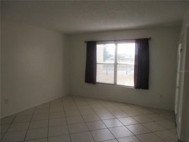 AFFORDBLE GROUND FLOOR 2/2 CONDOMINIUM JUST 500 FEET AWAY FROM on Country Club At Silver Springs Shores in Florida - for sale on GolfHomes.com, golf home, golf lot