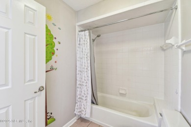 This beautifully maintained home offers breathtaking golf course on Jacksonville Golf and Country Club in Florida - for sale on GolfHomes.com, golf home, golf lot