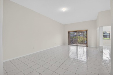 Nestled within a gated community, this 3 bedroom 2.5 bath on Boca Delray Golf and Country Club in Florida - for sale on GolfHomes.com, golf home, golf lot