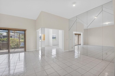 Nestled within a gated community, this 3 bedroom 2.5 bath on Boca Delray Golf and Country Club in Florida - for sale on GolfHomes.com, golf home, golf lot