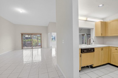 Nestled within a gated community, this 3 bedroom 2.5 bath on Boca Delray Golf and Country Club in Florida - for sale on GolfHomes.com, golf home, golf lot