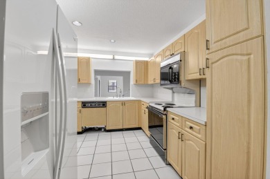 Nestled within a gated community, this 3 bedroom 2.5 bath on Boca Delray Golf and Country Club in Florida - for sale on GolfHomes.com, golf home, golf lot