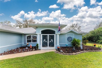 This custom-built, 4-bedroom, solar, waterfront home with a pool on Port Charlotte Golf Club in Florida - for sale on GolfHomes.com, golf home, golf lot