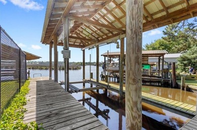 Stunning Waterfront Retreat in Gulf Hills - Ocean Springs on Gulf Hills Golf Club in MS - for sale on GolfHomes.com, golf home, golf lot