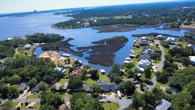 Stunning Waterfront Retreat in Gulf Hills - Ocean Springs on Gulf Hills Golf Club in MS - for sale on GolfHomes.com, golf home, golf lot