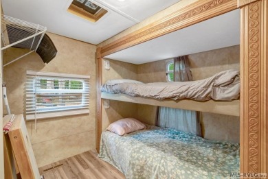 Enjoy the perfect blend of comfort and recreation in this 2 bed on River Ridge Golf Club in Virginia - for sale on GolfHomes.com, golf home, golf lot