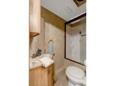 Enjoy the perfect blend of comfort and recreation in this 2 bed on River Ridge Golf Club in Virginia - for sale on GolfHomes.com, golf home, golf lot