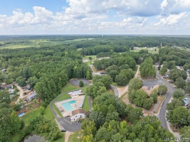 Enjoy the perfect blend of comfort and recreation in this 2 bed on River Ridge Golf Club in Virginia - for sale on GolfHomes.com, golf home, golf lot