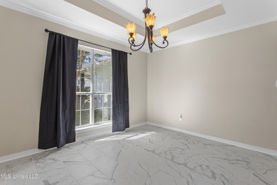 Welcome to this beautifully updated 3-bedroom, 2-bath home on Gulf Hills Golf Club in Mississippi - for sale on GolfHomes.com, golf home, golf lot