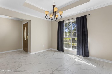 Welcome to this beautifully updated 3-bedroom, 2-bath home on Gulf Hills Golf Club in Mississippi - for sale on GolfHomes.com, golf home, golf lot