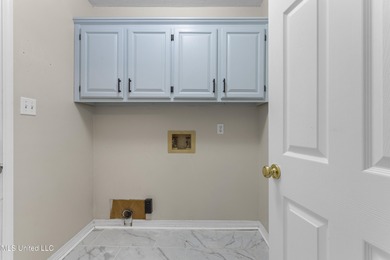 Welcome to this beautifully updated 3-bedroom, 2-bath home on Gulf Hills Golf Club in Mississippi - for sale on GolfHomes.com, golf home, golf lot