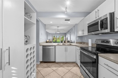 Live the Island Life! 2 Bedroom, 2 Bath condo with many updates on Isla Del Sol Yacht and Country Club in Florida - for sale on GolfHomes.com, golf home, golf lot