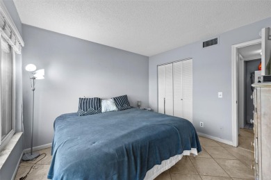 Live the Island Life! 2 Bedroom, 2 Bath condo with many updates on Isla Del Sol Yacht and Country Club in Florida - for sale on GolfHomes.com, golf home, golf lot