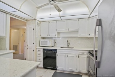 Enjoy first floor living with fantastic views from every room on Martin County Golf Course in Florida - for sale on GolfHomes.com, golf home, golf lot
